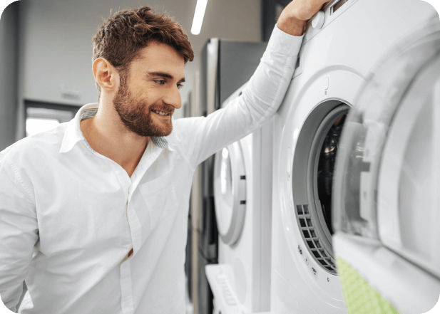 man picking washing machine